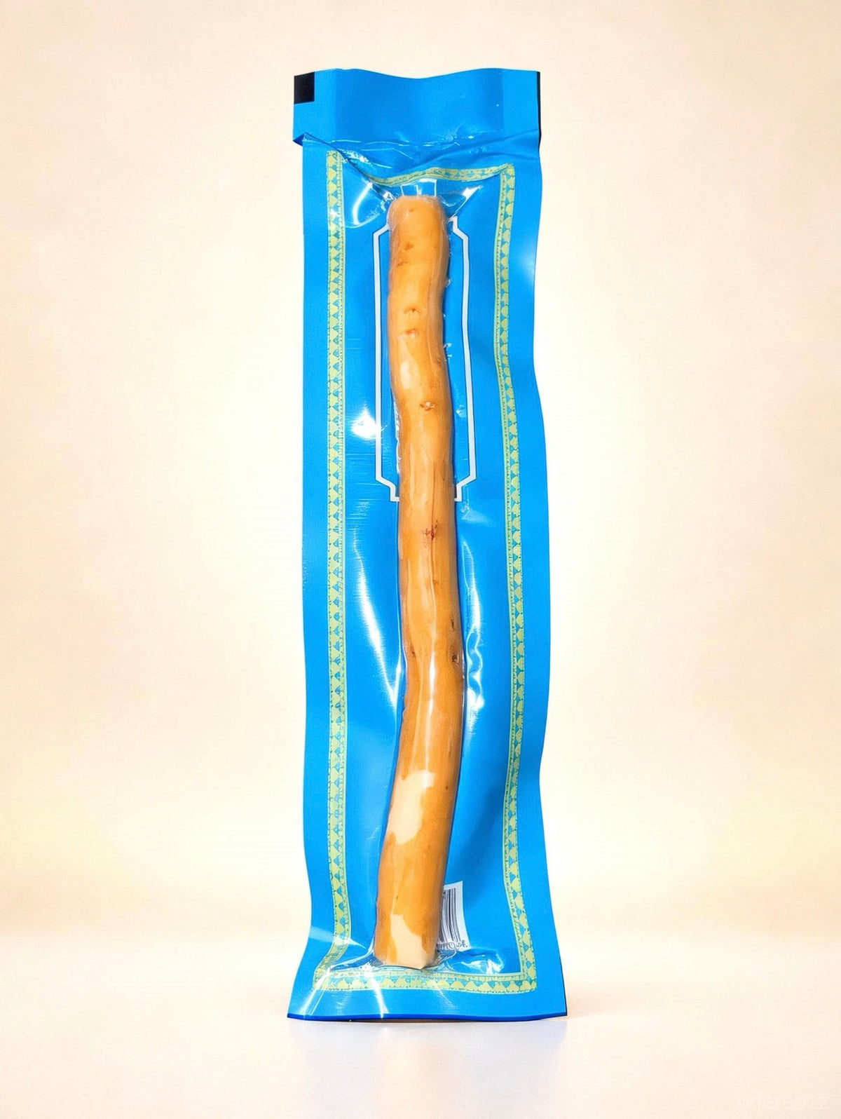 Single 6-inch natural Peelu Miswak stick individually packed in blue Al-Emaan Sewak wrapping with a clear viewing window.
